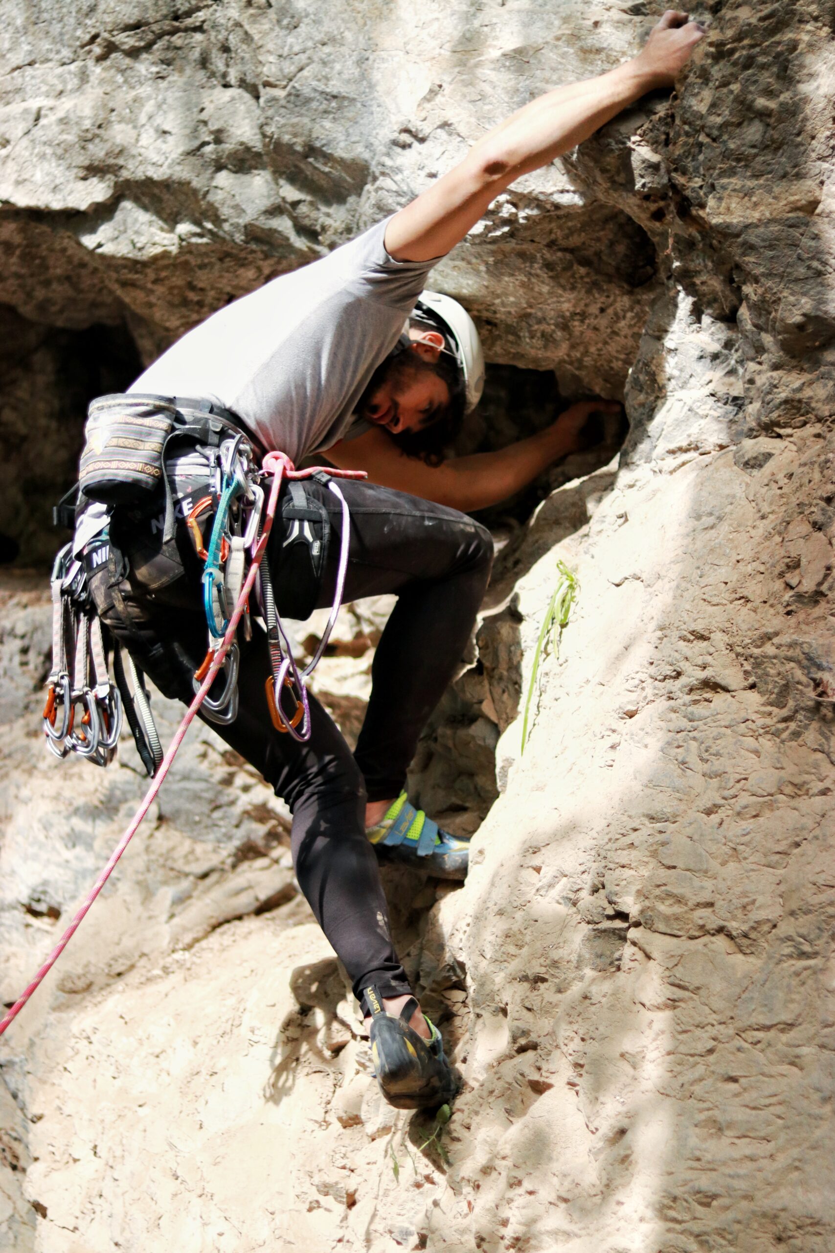 A rock climber climbing a rock
