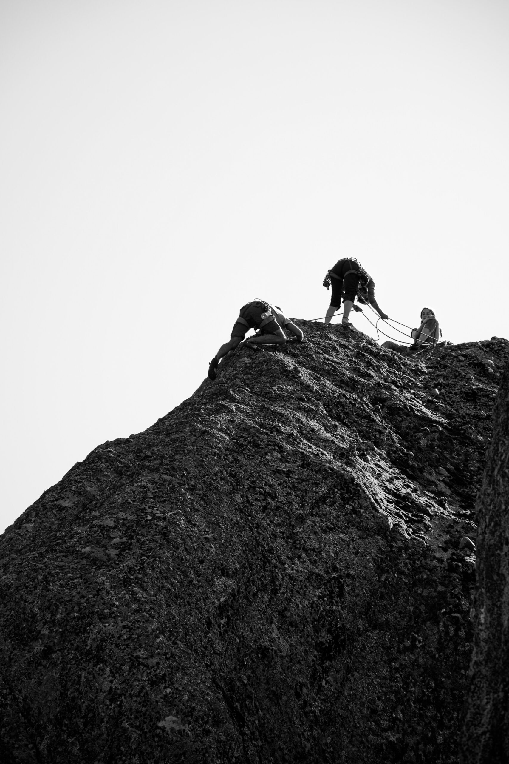 some climbers halfway up a crag